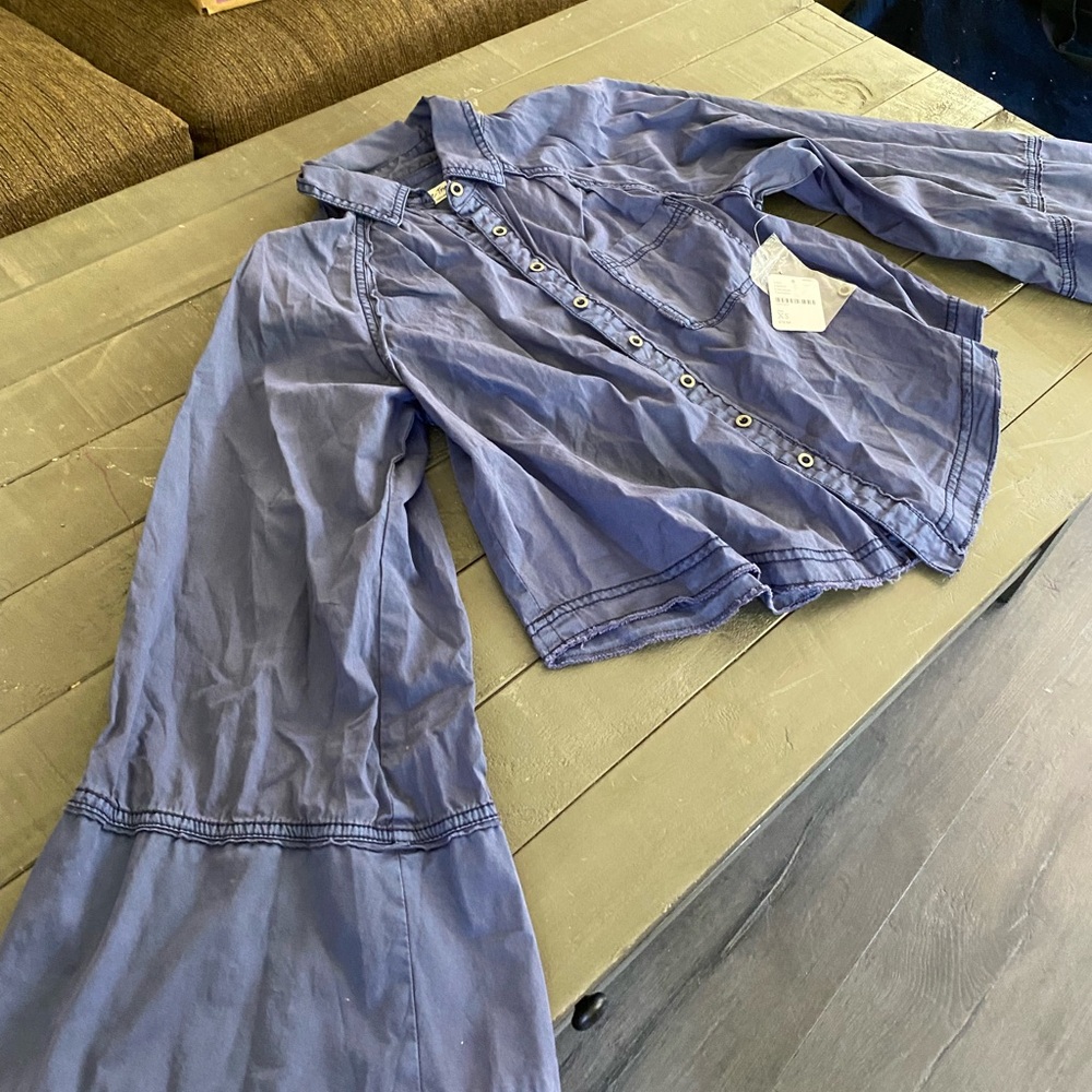 New with tags, free people shirt; never worn button up with parachute arms.